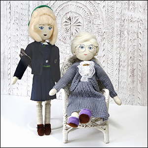 Keepsake doll in school uniform and keepsake doll as grandmother