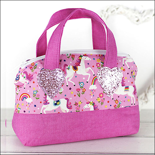 Toy handbag with zip closure in pink with unicorns and rainbows