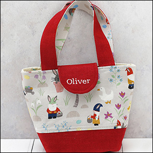 toy tote bag showing images of gnomes on egg hunt