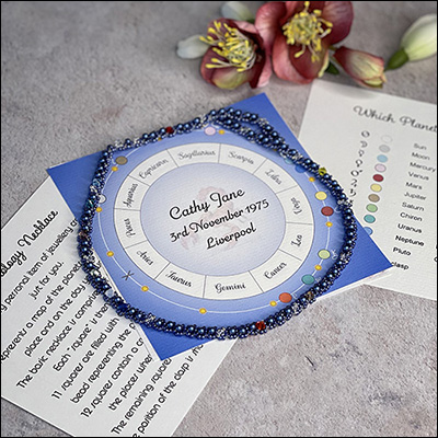 astrology beadwork necklace in blue pearl with chart and information sheets