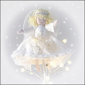 Christmas tree topper angel in white gown