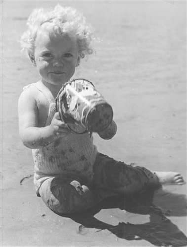 Child in knitted swimsuit